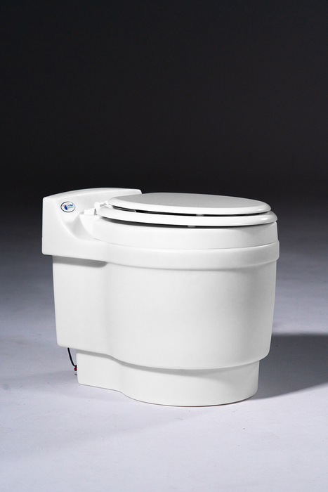 Laveo Dry Flush Closed, viewed from a side angle on Studio Background